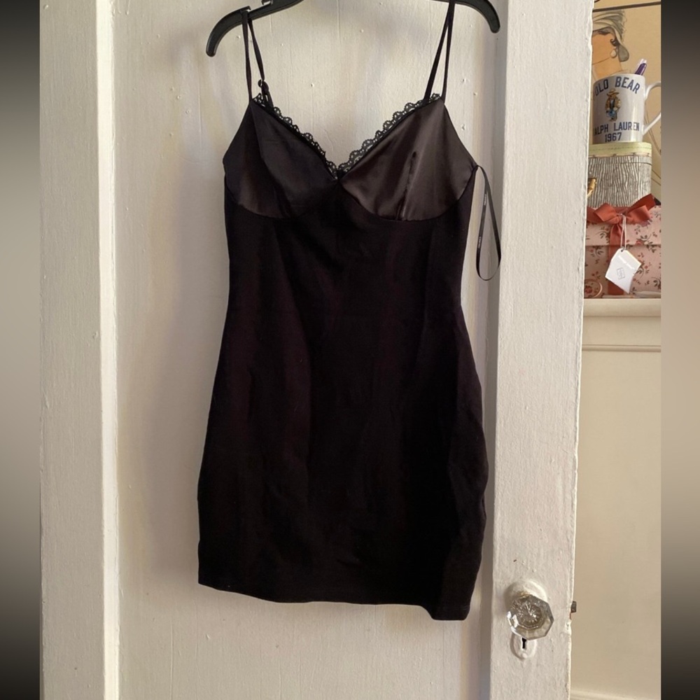 Forever 21 bodycon dress
Mini dress 
Adjustable straps 
Size small
NWOT
